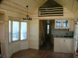 The steeper roof pitch gives you much more space to stack things or to add a loft and store things above. 10ft Or 12ft Wide Tiny House Tiny Houses Plans With Loft Tiny Beach House Tiny House Interior