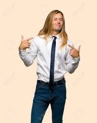 You feel respected for all of yourself. Blond Businessman With Long Hair Proud And Self Satisfied In Love Yourself Concept On Isolated Background Stock Photo Picture And Royalty Free Image Image 117702594