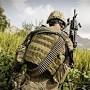 Profile Picture of U.S. Army Spc. Jake Amato patrols through a fieldon Google