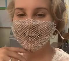 Why is she at an event with a a third said: Dlisted Lana Del Rey Swears Her Mesh Mask Was Actually Lined With Plastic