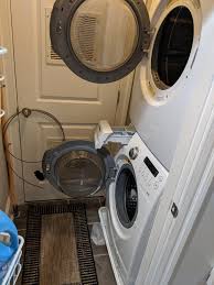 A stackable washer and dryer can be ideal in some situations. How Would You Go About Replacing This Stacked Washer Dryer In Such Tight Quarters Hvac Unit Directly Behind Door In Picture Couple Inches On Either Side Of Washer Dryer Yellow Gas Line Is At