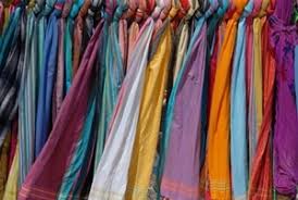 Store each individual rolled scarf in a single in compartment of a cubed drawer organizer. Scarf Storage Solutions
