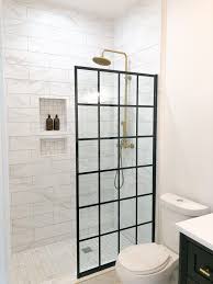Adding wooden shelving might interfere with the delicate balance of light purple and. The Harrison Project The Final Reveal Shower Remodel Black Shower Doors Brass Shower Head