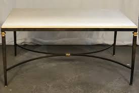 An elegant limestone top sits balanced on perfectly fitted groves that open into the wooden legs of this jorge zalszupin coffee table. Josephine Cocktail Table Kathy Slater Designs