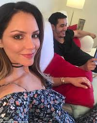 Katharine McPhee feeds co-star Kurt Teixeira fries