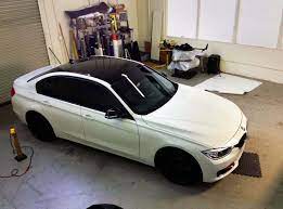Vinyl wrap a hood/bonnet larger than 60 inches w/ matte metallic lava red. Car Roof Vinyl Wrap Installation Service