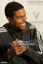 Former Texas Legends' coach Del Harris congratulates Chris... News Photo