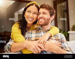Interracial couple sitting on couch hi-res stock photography and images -  Alamy