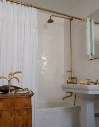 Made of fine artistic craftsmanship, this shower riser was designed to be paired with a freestanding or clawfoot tub. Exposed Plumbing Design Ideas