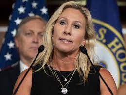 Marjorie Taylor Greene tweets video that shows her kicking youth activist : NPR