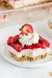 Strawberry Pretzel Salad On A White Plate With Cool Whip And A Strawberry On Top In 2020 Easy Cheesecake Recipes Easy No Bake Cheesecake Desserts