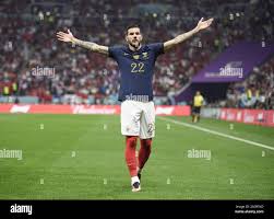 Frances Theo Hernandez spreads his arms in celebration after scoring the  opening goal against Morocco during a World Cup semifinal football match at  Al-Bayt Stadium in Al Khor, Qatar, on Dec. 14,