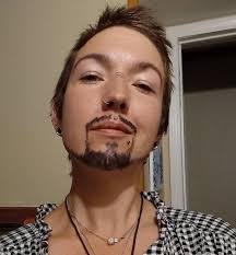 Appoligize for the loopy face lol but love the way the sunlight has  captured the colour of my beard,secondly got my first tatt a year ago at  the young age of 59,had