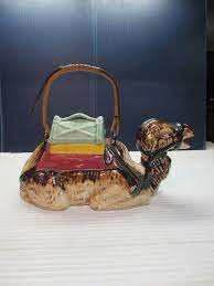 This very feminine ceramic teapot with matching stand is in a beautiful blue chintz pattern with sprays of colorful flowers. Pin On I Heart Camels