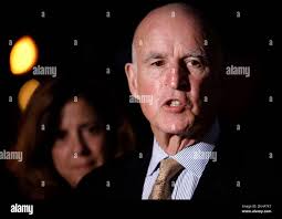 California Governor Jerry Brown joined by his wife Anne Gust-Brown, as he  speaks to the news media in front of the Governor's Mansion near the State  Capitol