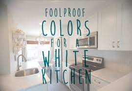 The burgandy color in the stone really picks up the richness of the cabinet color, and the cream/ gray in the granite adds contrast if you wanted more a white/ gray color, try looking at a super white quartzite or a white macaubas quartzite: White Kitchen Colors For Your Home