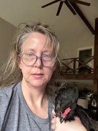 Poulette patiently waiting for the kitchen door to open so she can get in  to steal the cats food!