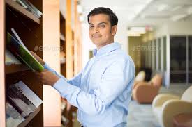 Check spelling or type a new query. Closeup Portrait Young Business Man In Blue Shirt Reading Perusing Books Magazines And Periodicals At Library Stock Images Page Everypixel
