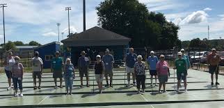 Shuffleboarders: No state tourney, but still having fun