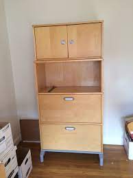 Office filing cabinet designs come with different storage capacities. Ikea Office Filing Cabinet Two File Drawers Plus Open Shelf Above Extra Doored Cabinet Is A Separate Piece Which Can Ikea Office Filing Cabinet Open Shelving