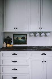 A Food Blogger S Rustic Diy Renovation In Portland Or Dark And Moody Edition Remodelista Kitchen Wall Cabinets Installing Kitchen Cabinets Upper Kitchen Cabinets