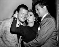 For in it's a great feeling, which came to the strand yesterday, that division of the motion picture industry ruled by the brothers warner, is lightly lampooning its stars, directors, producers and publicity men and having a genuinely nice time doing it. It S A Great Feeling