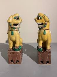 She has 2 mirrored red, ceramic/porcelain foo dogs (lions?) purchased by her father in japan around 1954, she was a child at the time. Pair Of Chinese Yellow Glazed Porcelain Foo Dogs Circa 1930s For Sale At 1stdibs