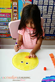 Making the smaller parts for your paper plate easter bunny. Paper Plate Easter Chick Kids Craft Simply Today Life