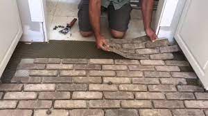 If you love the brick look, but aren't sure if you want to have it permanently installed or are worried that real brick pavers might be too heavy for your subfloor, there are a number of alternative faux brick flooring options to consider. Fastest And Easiest Way To Install Brick Flooring Youtube