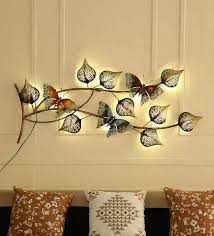 There is a great deal of wall paint designs available in the market, which can help give your room a totally amazing and modern look. Buy Metal Butterfly On Leaf With Led In Multicolour Wall Art By Malik Design Online Floral Metal Art Metal Wall Art Home Decor Pepperfry Product