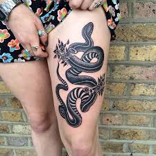Snake tattoo designs may take the form of serpents, vipers or of intriguing traditional snake patterns. Snake Tattoo Woman Thigh Novocom Top