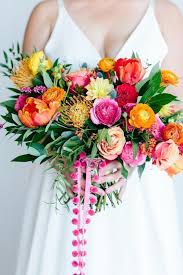 These handcrafted arrangements feature bold, festive colors like hot pink, orange, and purple for a cheery look. Bright Whimsical Wedding Invites Flowers Wedding Bouquet Flowers Weddingdecor We Bright Wedding Colors Colorful Wedding Bouquet Wedding Flowers Summer
