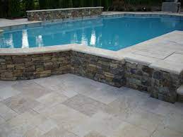 Ivory travertine layers beige over cream with an occasional hint of walnut. 12x24 Ivory Swirl Tumbled Travertine Pool Coping 2 Inch