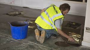 A Uk Tiles Direct Tiler Appling Kerakoll Keratech R10 Self Leveling Compound Before Laying The Large Format Porcelain Tiles Tiles Direct Tiles Porcelain Tile