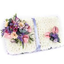 We work closely with our local funeral home and support their efforts to provide guidance for your professional florist can help you choose the best options for the the season and type of service. Open Book Funeral Flowers Rushden