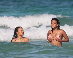 Christina Milian's boobs almost pop out of her bikini as she is wiped out  by a wave on the beach in Miami with Karrueche Tran | The Irish Sun