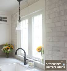 A few minimal flower arrangements provide a welcoming organic touch. Carrara Subway Tile Marble 3x6