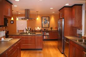 Kitchen Remodel Using Bamboo Flooring Cherry Cabinetry Corian Counters And Black Con Bamboo Flooring Kitchen Kitchen Island With Drawers Kitchen Design Decor