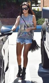 Here S Where Kendall Jenner And Kim And Kourtney Kardashian Get Their Rocker T Shirts Kardashian Style Kourtney Kardashian Style Fashion