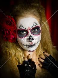 ugly looking female with face paint and roses in hair
