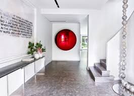 A riotous bespoke chandelier is paired with contemporary art and cabinetry in this unique entry foyer by alene workman interior design. Jeefoi3mo N0m