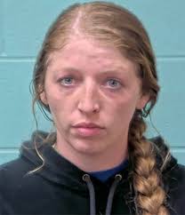 A woman suspected of dealing narcotics at an area convenience store where  she was employed was arrested Thursday