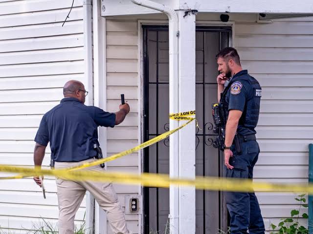 Police work the scene after chasing a suspect in an officer-involved shooting