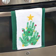 Add a pop of color to your kitchen with these diy holiday dish towels! Handprint Christmas Tree Kitchen Towel Easy Diy Gift It S Always Autumn