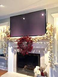 Mantle Decoration For Christmas With A Big Screen Tv Christmas Fireplace Decor Christmas Mantel Decorations Christmas Mantle Decor