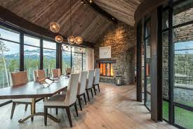 The way this dining table is aligned with the rows of the vineyard makes this dining room a dream come true. Stone And Timber Mountain Dream House Showcases Big Sky Views