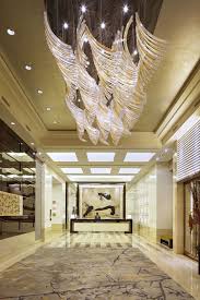 Lasvit Turns Glass Into Breathtaking Light And Design Experiences Hotel Chandelier Lobby Design Hotel Interior Design