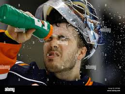 New York Islanders goalie Yann Danis sprays water