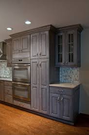 The pigment in the stain will block a lot of the uv light which causes the problem. Grey Stained Walnut Kitchen Cabinetry Transitional Kitchen Chicago By Sheri S Design And Consulting Houzz