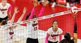 Nebraska volleyball players celebrate during a match at the Devaney Center